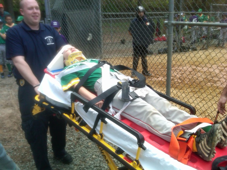 jacob on stretcher kid baseball injuries 